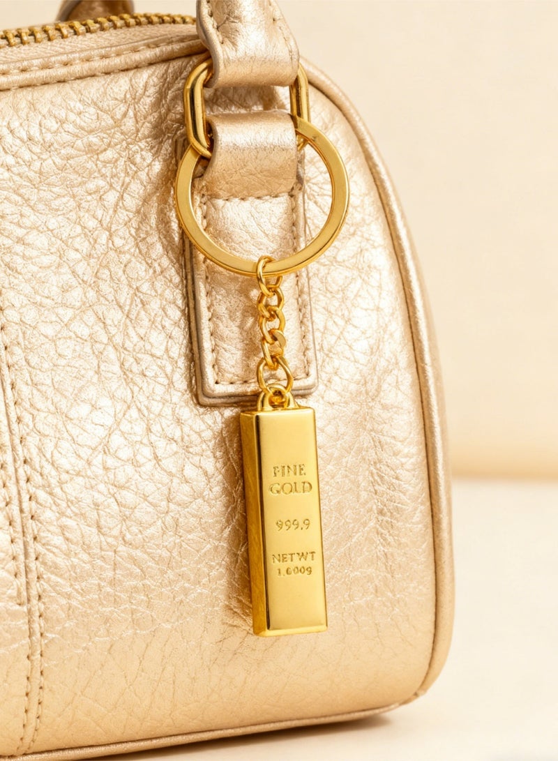 مفتاحيّة شكل قطعة ذهب وهميّة – مفتاحيّة ذهبية رفيعة الدقة، رمز للثروة والنجاح - Image 4